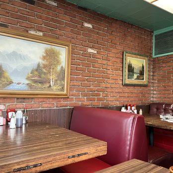 Rae's Restaurant - a man sitting at a table - Diners Near Me - Santa Monica, California Rae's Restaurant - a man sitting at a table - Diners Near Me - Santa Monica, California