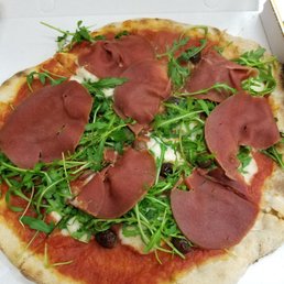 Vegan pizza, vegan meat and rice cheese. Vegan pizza, vegan meat and rice cheese.