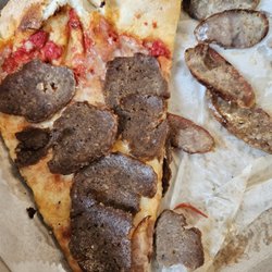 Leonardo's Pizza & Restaurant - Won't stay on the pizza