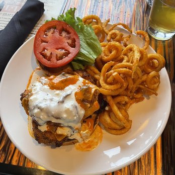 Uptown Grille - Buffalo Chicken Sandwich and Curly Fries - American Near Me - Commerce Township, Michigan Uptown Grille - Buffalo Chicken Sandwich and Curly Fries - American Near Me - Commerce Township, Michigan