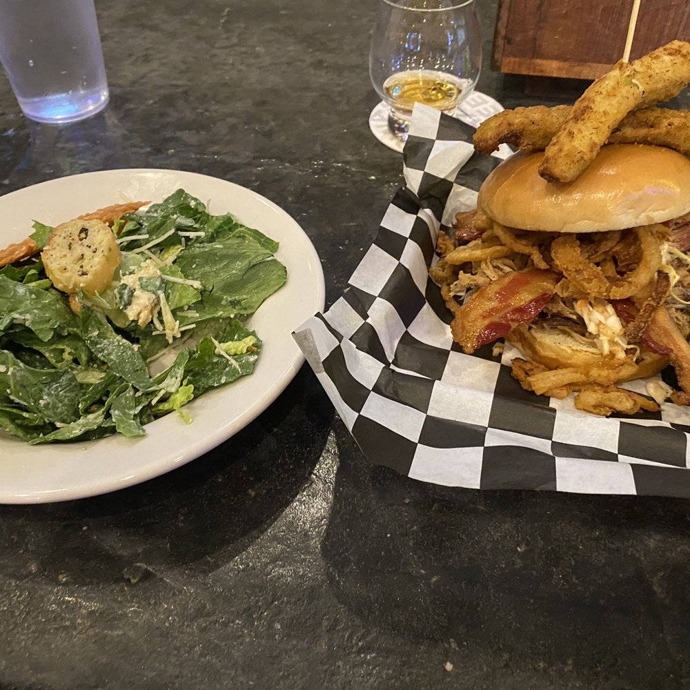 Whiskey Road Tavern & Grill - Loaded Bourbon Pulled Pork Sandwich with a Caesar Salad - Bars Near Me - Cedar Falls, Iowa Whiskey Road Tavern & Grill - Loaded Bourbon Pulled Pork Sandwich with a Caesar Salad - Bars Near Me - Cedar Falls, Iowa