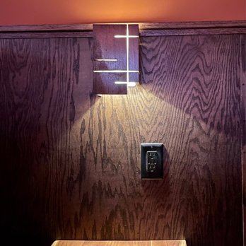 B-Side - a wood paneled room with a light on the wall - Dive Bars Near Me - Sacramento, California B-Side - a wood paneled room with a light on the wall - Dive Bars Near Me - Sacramento, California