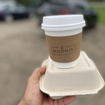 Heatherlea Farm Shoppe - a hand holding a cup of coffee - Cafes Near Me - Caledon, Ontario