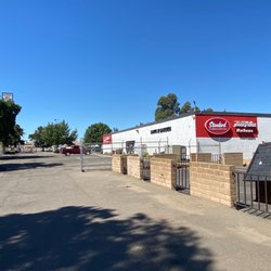 Standard True Value - Manteca - Entrance sits back from the Main Street down a long drive way past the Kia/Hyundai dealership.