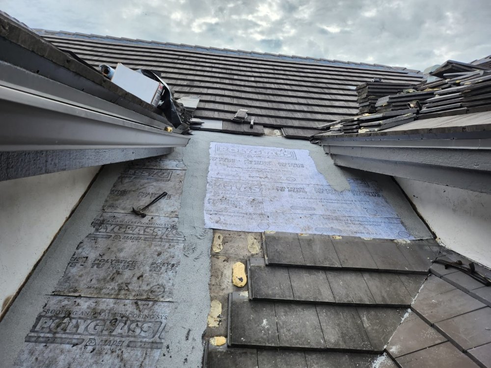 Slide of Extra Myles Roofing