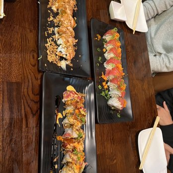 Sushi District - a variety of sushi dishes on black plates - Sushi Bars Near Me - Costa Mesa, California Sushi District - a variety of sushi dishes on black plates - Sushi Bars Near Me - Costa Mesa, California