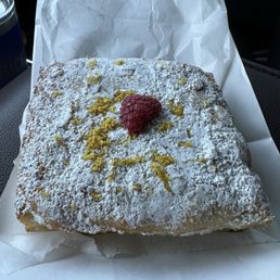 Some sort of french bread soaked in a citrus syrup. It is delicious!