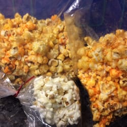 Pop's Corn Shoppe - Left: cheddar/caramel Right: jalapeño cheddar Front: marshmallow popcorn ball