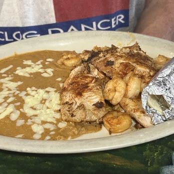los molcajetes - Tilapia with shrimp and refried beans. - Mexican Near Me - Cleveland, Oklahoma los molcajetes - Tilapia with shrimp and refried beans. - Mexican Near Me - Cleveland, Oklahoma