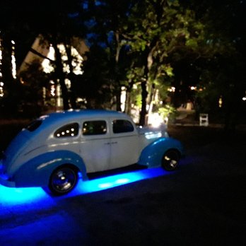 Charles Vintage Limousine Service - The 1938 Ford Deluxe is lit up for the grand exit of the wedding. - Limos Near Me - Rockwall, Texas Charles Vintage Limousine Service - The 1938 Ford Deluxe is lit up for the grand exit of the wedding. - Limos Near Me - Rockwall, Texas