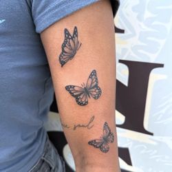 Queen of Hearts Tattoos & Body Piercing