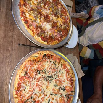 Crust Pizza - Rayford - two pizzas on a table - Pizza Near Me - Spring, Texas Crust Pizza - Rayford - two pizzas on a table - Pizza Near Me - Spring, Texas