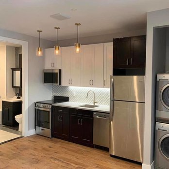 Sky Vision Construction Services - a kitchen with a washer and dryer - General Contractors Near Me - Queens, New York Sky Vision Construction Services - a kitchen with a washer and dryer - General Contractors Near Me - Queens, New York