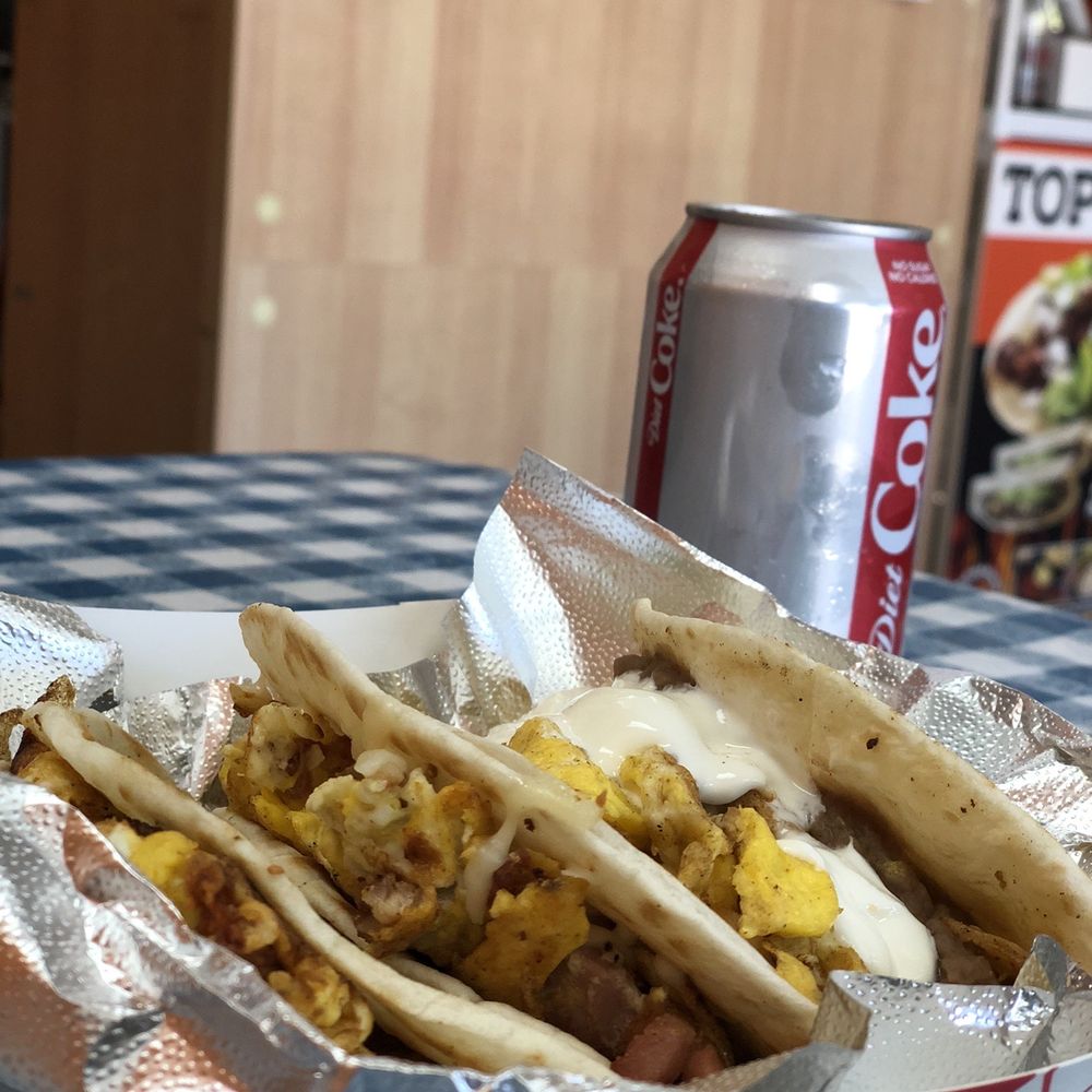 Top Taco - Ordered 3 breakfast tacos.  Ate 2 and took one to go!  Chilaquiles taco with Sour Cream was terrific! Also, egg & bacon, egg & chorizo - Food Trucks Near Me - Austin, Texas