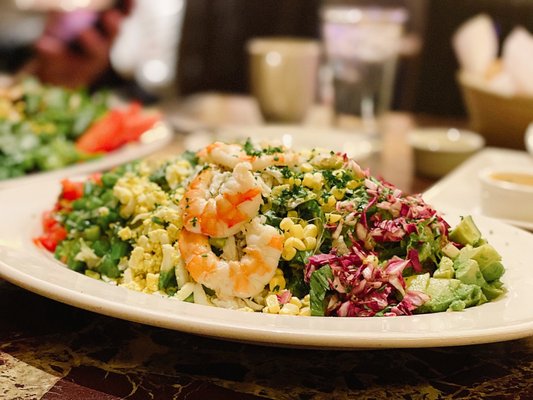 Photo of Grand Lux Cafe - Las Vegas, NV, US. Seafood salad - lump crab, shrimp, avo, tomato, corn, green beans, egg, celery, green onion