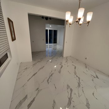 Thacker Floor Coverings - a room with a marble floor - Tiling Near Me Thacker Floor Coverings - a room with a marble floor - Tiling Near Me