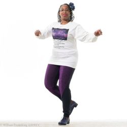 Rhythm of the Street Dance Studio - Lyn Cole tap dancing in purple pants and a Rhythm of the Street Dance Studio t-shirt.