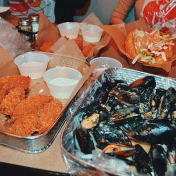 Cajun Boil - Fried Ousters, boiled Mussels, and in the back a Shrimp Po Boy - Cajun/Creole Near Me - Miami, Florida Cajun Boil - Fried Ousters, boiled Mussels, and in the back a Shrimp Po Boy - Cajun/Creole Near Me - Miami, Florida
