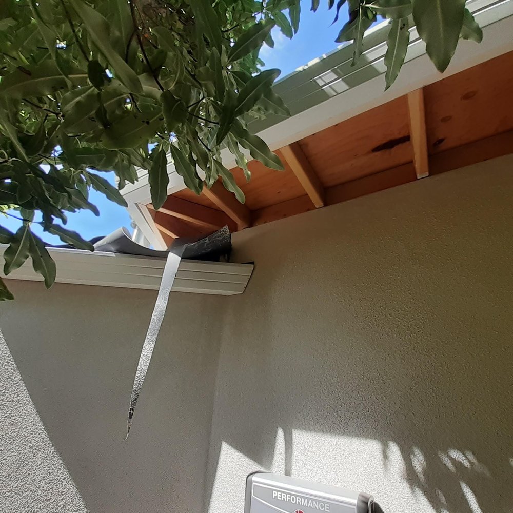 Slide of JB Rain Gutter installation