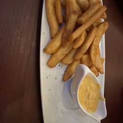The Lion & Rose Restaurant & Pub - Chips with beer cheeses and bacon.