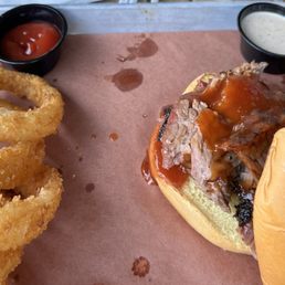 Tiny brisket sandwich with the up charged onion rings. Tiny brisket sandwich with the up charged onion rings.