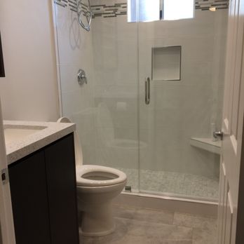 Makeover Builders, Inc - Terrific tile work in walk-in shower, custom vanity and countertop and tiled floors throughout home - General Contractors Near Me - Woodland Hills, California Makeover Builders, Inc - Terrific tile work in walk-in shower, custom vanity and countertop and tiled floors throughout home - General Contractors Near Me - Woodland Hills, California