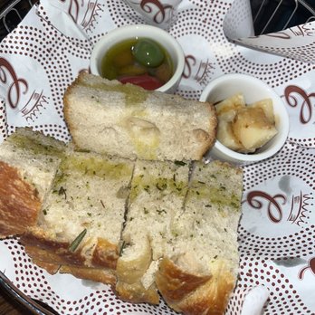 Contessa - Boston - focaccia, warm olives, and balsamic glaze parmesan - Italian Near Me - Boston, Massachusetts Contessa - Boston - focaccia, warm olives, and balsamic glaze parmesan - Italian Near Me - Boston, Massachusetts