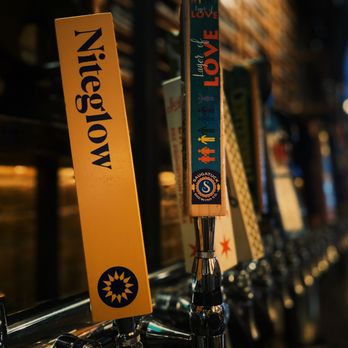 Centennial Crafted Beer & Eatery - a row of beer taps - Beer Bar Near Me - Chicago, Illinois