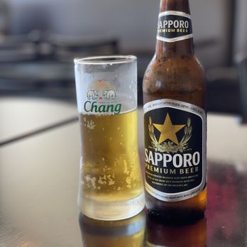 Bamboo Thai Bistro - a glass of beer and a bottle - Thai Near Me - Redondo Beach, California Bamboo Thai Bistro - a glass of beer and a bottle - Thai Near Me - Redondo Beach, California