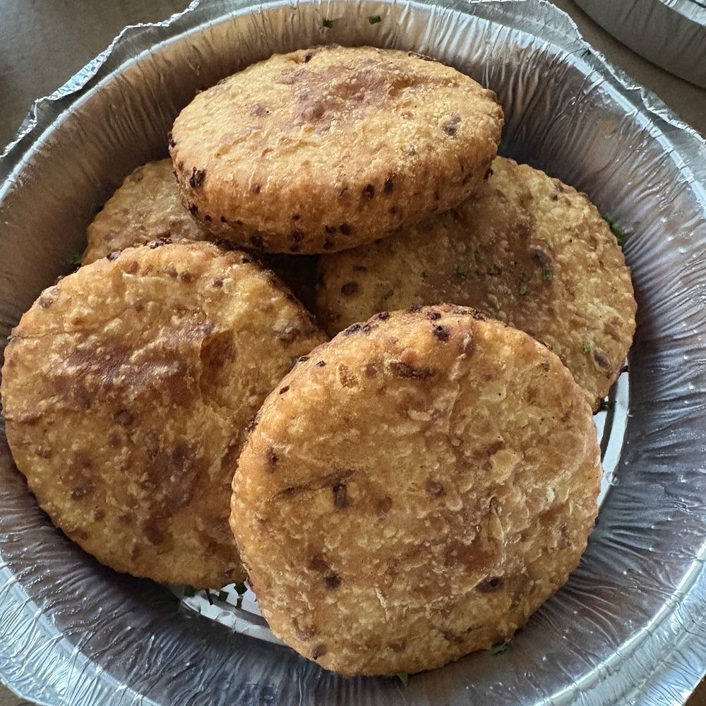 The Mill - FRIED BISCUITS (smoked Gouda, duck fat fried. Comes with pepper jelly) - Steakhouses Near Me - Raleigh, North Carolina The Mill - FRIED BISCUITS (smoked Gouda, duck fat fried. Comes with pepper jelly) - Steakhouses Near Me - Raleigh, North Carolina