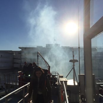 Colonia Express - Colonia Express' smoky boat after being towed back to BA port due to lack of maintenance - Transportation Near Me - Buenos Aires, C