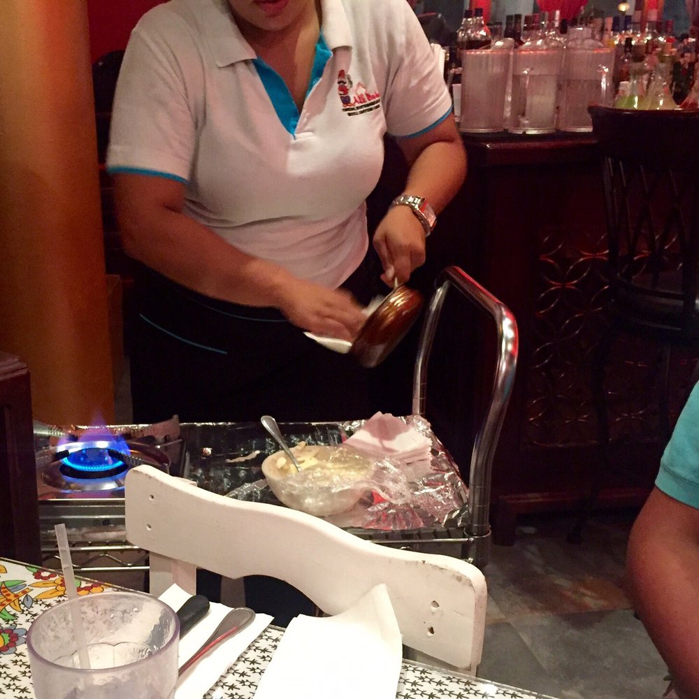 Ali Baba - Browning the butter for Eskander Kabob, table side - Turkish Near Me - San Juan, Puerto Rico Ali Baba - Browning the butter for Eskander Kabob, table side - Turkish Near Me - San Juan, Puerto Rico