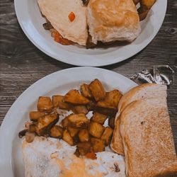 Fork and Spoon - 2 omelets with potatoes, biscuit and toast.