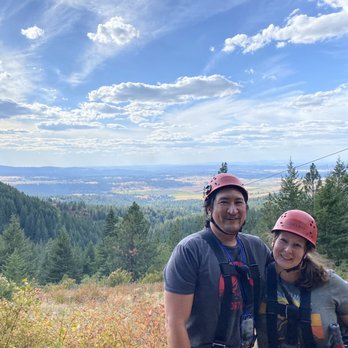 Mica Moon Zip Tours - Selfie of us, you can see 'The Big Momma' zip line behind us. It goes over a canyon and is over 3500' long! - Tours Near Me - Liberty Lake, Washington Mica Moon Zip Tours - Selfie of us, you can see 'The Big Momma' zip line behind us. It goes over a canyon and is over 3500' long! - Tours Near Me - Liberty Lake, Washington