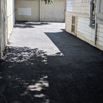 California Asphalt Professionals - View of dual single door garages paved with asphalt - Masonry/Concrete Near Me California Asphalt Professionals - View of dual single door garages paved with asphalt - Masonry/Concrete Near Me
