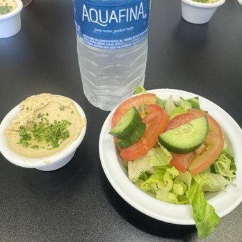 Kabab El Basha - My cat's dish is bigger than this salad bowl and the hummus is about 2 spoons. This is a small water bottle as a comparison. - Mediterranean Near Me - Corona , California Kabab El Basha - My cat's dish is bigger than this salad bowl and the hummus is about 2 spoons. This is a small water bottle as a comparison. - Mediterranean Near Me - Corona , California