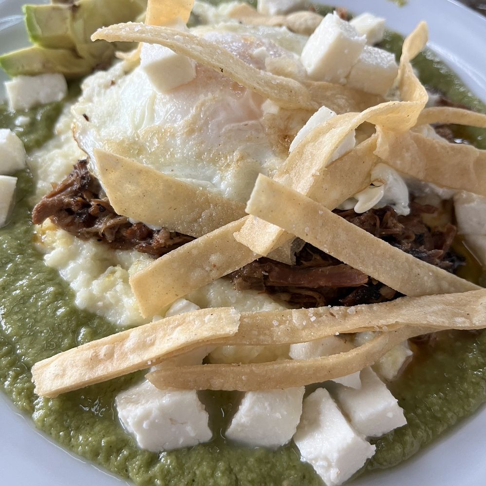 Richter Bakhaus - Pulled pork and grits plate on verde sauce and avocado. Just Ok - Coffee & Tea Near Me - Boerne, Texas Richter Bakhaus - Pulled pork and grits plate on verde sauce and avocado. Just Ok - Coffee & Tea Near Me - Boerne, Texas