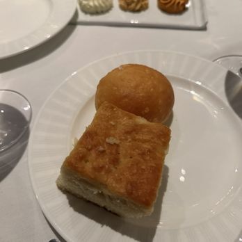 Restaurant R'evolution - Complimentary biscuit and roll with butter trio (normal, sweet, and Cajun) - Cajun/Creole Near Me - New Orleans, Louisiana Restaurant R'evolution - Complimentary biscuit and roll with butter trio (normal, sweet, and Cajun) - Cajun/Creole Near Me - New Orleans, Louisiana