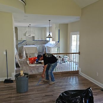 Royal Estates Contracting - a woman cleaning a house - General Contractors Near Me Royal Estates Contracting - a woman cleaning a house - General Contractors Near Me