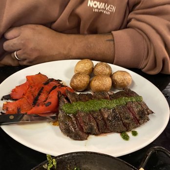 Flores Restaurant & Bar - Skirt steak with chimichurri, roasted red pepper and potatoes - Bars Near Me - Wappingers Falls, New York Flores Restaurant & Bar - Skirt steak with chimichurri, roasted red pepper and potatoes - Bars Near Me - Wappingers Falls, New York