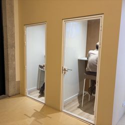 Regus Porto S. Bento - Two phone booths in lounge area