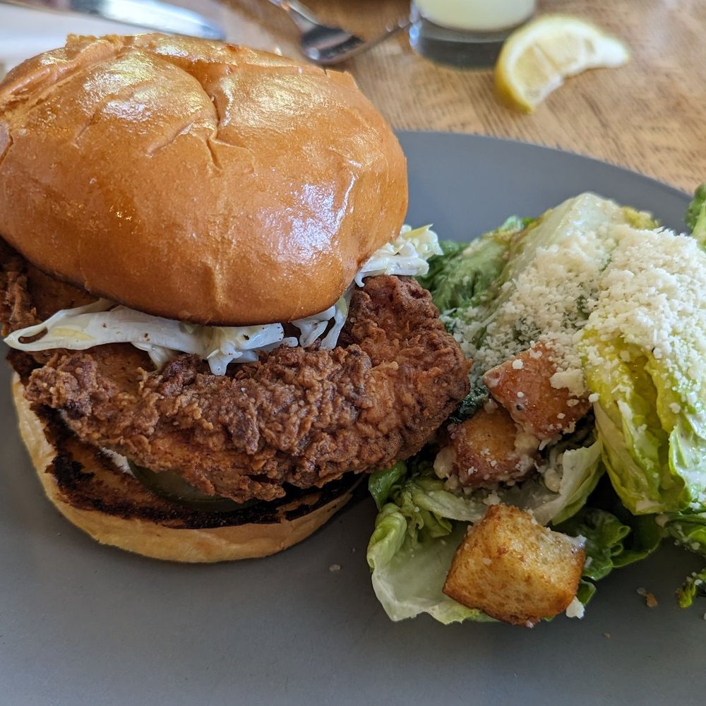 Due West Tavern - Fried chicken sandwich with salad - Cocktail Bars Near Me - Olema, California