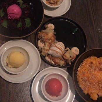 Marisol - Pictured: Thai tea/ Mint Orange/ raspberry ice cream, Miso Butterscotch pudding, Tres Leche, and a Chocolate dessert with beet ice cream. - New American Near Me - Chicago, Illinois Marisol - Pictured: Thai tea/ Mint Orange/ raspberry ice cream, Miso Butterscotch pudding, Tres Leche, and a Chocolate dessert with beet ice cream. - New American Near Me - Chicago, Illinois