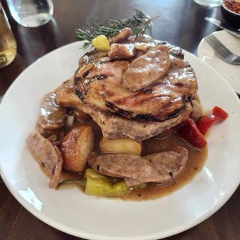 Addeo's of the Bronx - Pork chops with sliced sausages, Braised potatoes and peppers. - Pizza Near Me - Bronx, New York Addeo's of the Bronx - Pork chops with sliced sausages, Braised potatoes and peppers. - Pizza Near Me - Bronx, New York
