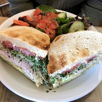 Crossroads Cafe - Tom Tom Club (turkey, sprouts, avocado, tomato, mayo) w/Mixed Green Salad - Cafes Near Me - Joshua Tree, California Crossroads Cafe - Tom Tom Club (turkey, sprouts, avocado, tomato, mayo) w/Mixed Green Salad - Cafes Near Me - Joshua Tree, California