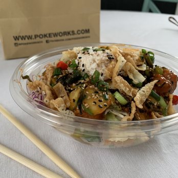 Pokeworks - Regular sized build your own double spicy tuna with pretty much every topping. It was so much higher and prettier before the lid. - Poke Near Me - Troy, Michigan