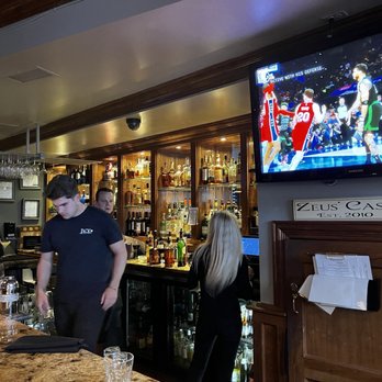 Ivy Restaurant - a man standing at the bar - Seafood Near Me - Wheaton, Illinois