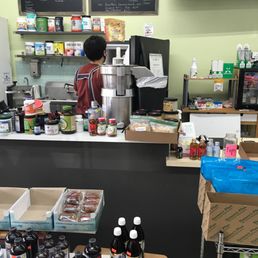 a young boy in a grocery store a young boy in a grocery store