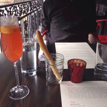 BoccaLupo - Our porch place setting with breadsticks, cocktail, and menus. - Italian Near Me - Atlanta, Georgia