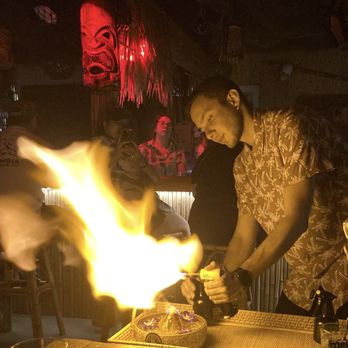 Pineapple Parlor - Lighting up the volcano bowl - Tiki Bars Near Me - Galveston, Texas Pineapple Parlor - Lighting up the volcano bowl - Tiki Bars Near Me - Galveston, Texas